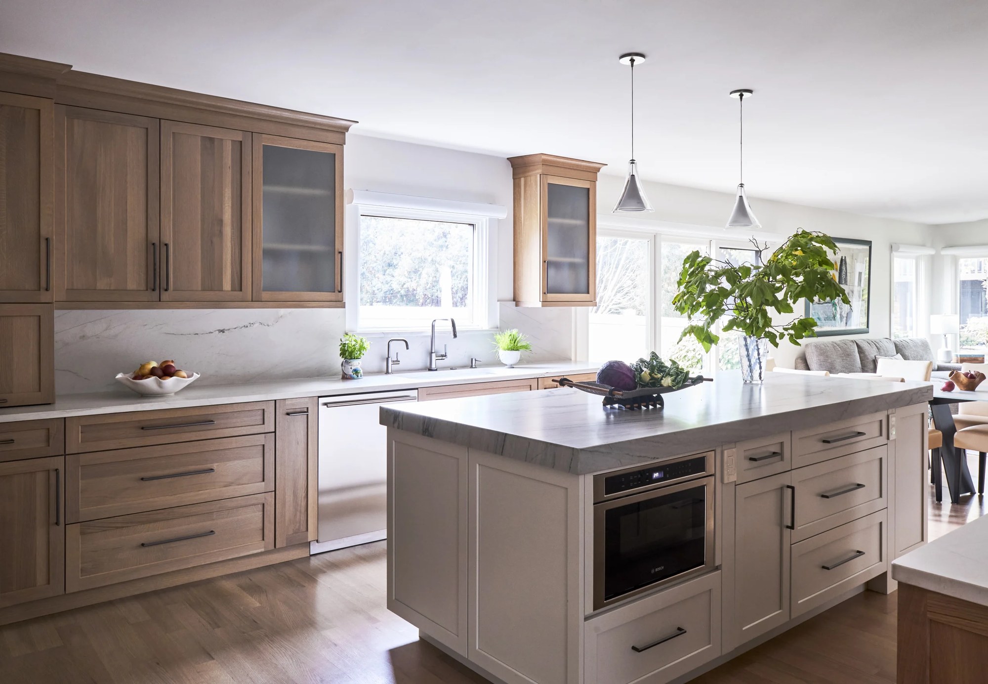 Kitchen with a full-height veined stone slab backsplash cut from the same material as the countertop and island top